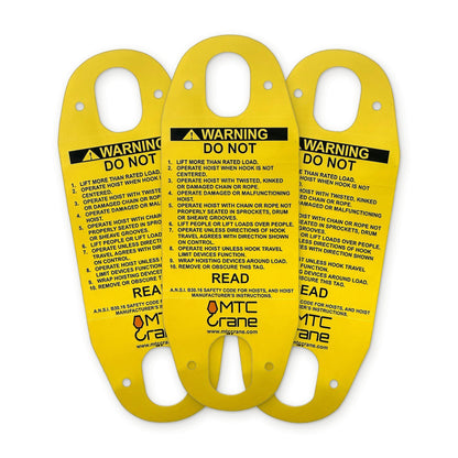 Three identical yellow MTC Crane hoist pendant warning tags fanned out, English WARNING / DO NOT side